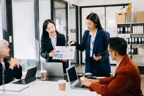 Business team discuss at meeting room. working together with laptop ,tablet and smart phone on desk Financial accountant , planner , meeting , introduction concept.