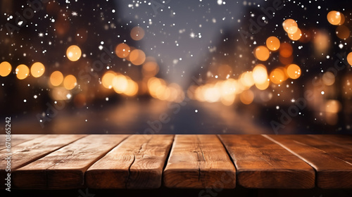 Wooden table in front of blurred christmas background with snowfall