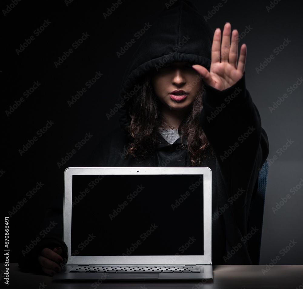 Fototapeta premium Female hacker hacking security firewall late in office