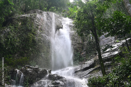 Beautiful waterfall in the rainforest in Thailand. Adventure and travel concept