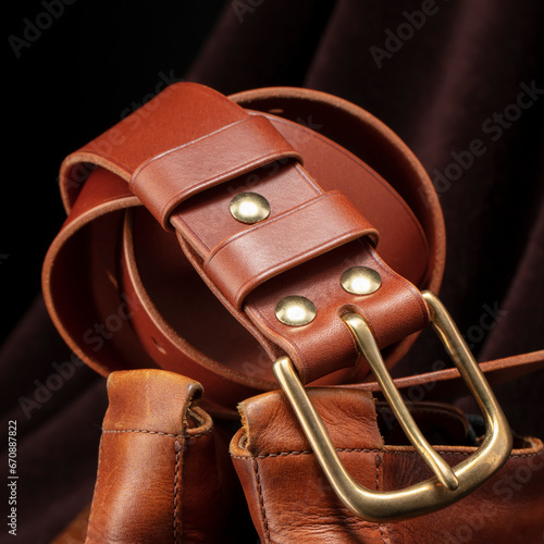 Part of a brown belt made of genuine expensive leather.
