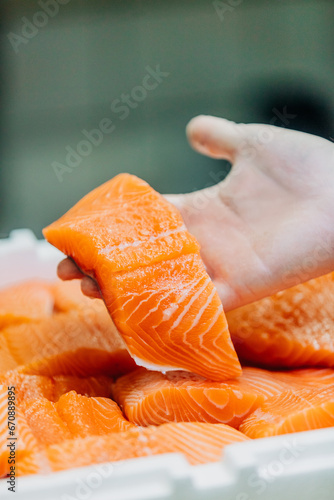 cut and packaged pieces of salmon in a restaurant before cooking