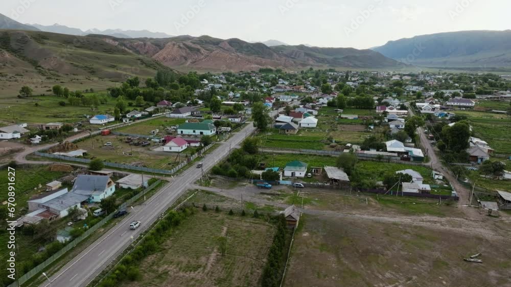 Tranquil Village At The Foothills Of Trans-Ili Alatau In Saty, Kazakhstan, Central Asia. Aerial Drone Shot Tranquil Village At The Foothills Of Trans-Ili Alatau In Saty, Kazakhstan, Central Asia. Aerial Drone Shot