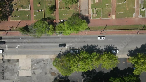 Aerial nose down shot of a cemetery, with tombs, trees, Georgia clay, and intricate street patterns. photo