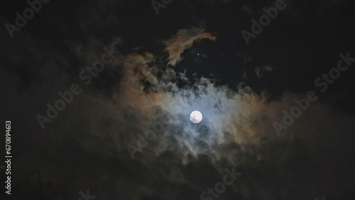 Night Cloudy Sky with Full Moon in Conjuction with Jupiter Planet Bright Star
