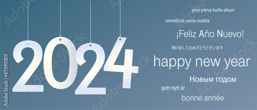 2024 Happy New Year in several languages greeting text on soft gradient background