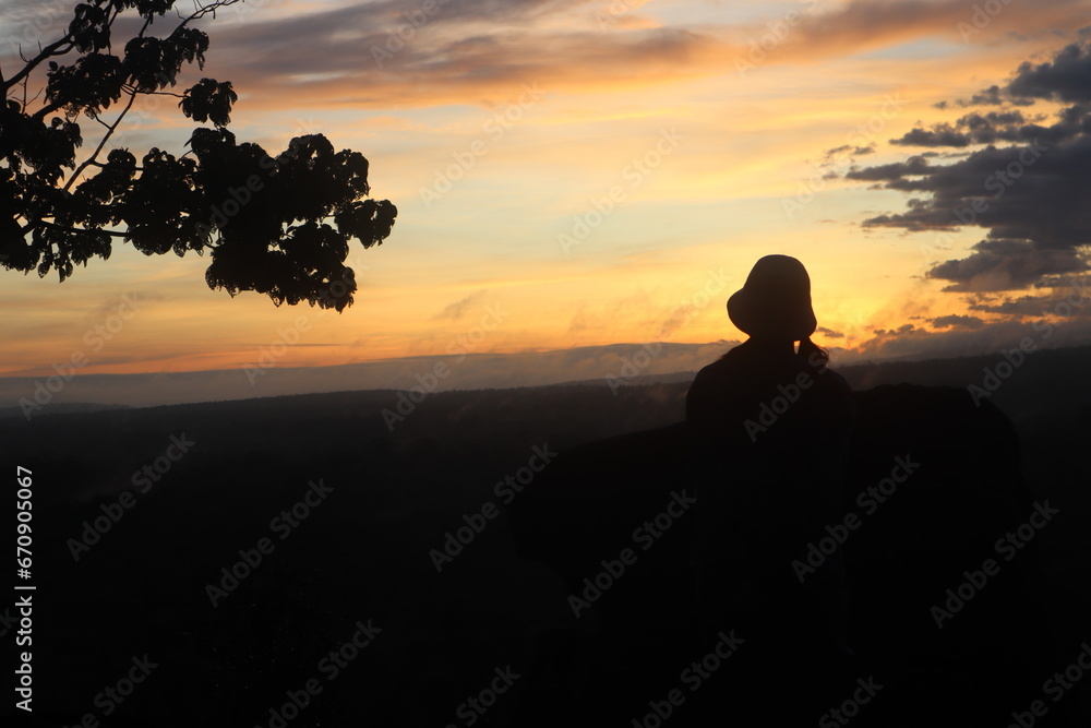 a silhouette of a group of people at sunrise in Bromo