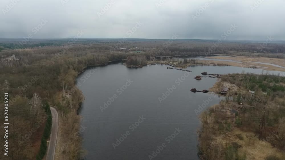 backwater in the Chernobyl exclusion zone, place of eternal mooring of ships, view from a drone, radiation around backwater in the Chernobyl exclusion zone, place of eternal mooring of ships, view from a drone, radiation around