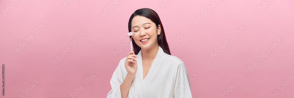 Woman, beauty and derma roller with face, happy with facial massage and skincare on studio background. Woman, beauty and derma roller with face, happy with facial massage and skincare on studio background.