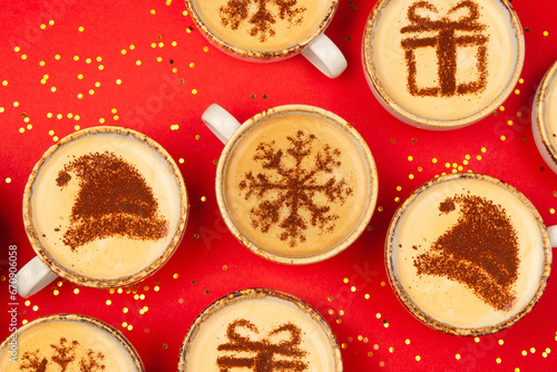 Christmas concept design on coffee cups on red background.