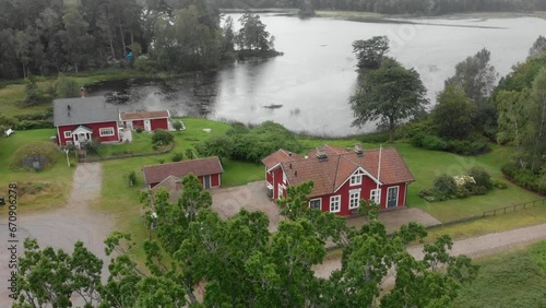 Famous Piksborg red houses in middle of nature at Sweden, aerial photo