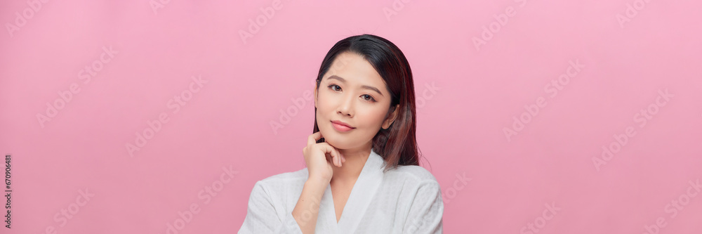 Banner of pretty black woman touching her chin over pink background with copy space Banner of pretty black woman touching her chin over pink background with copy space