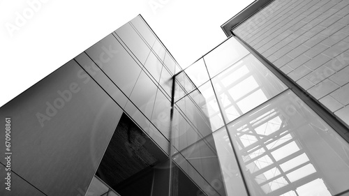 Abstract reflection of modern city glass facades. Modern office building detail, glass surface. Black and white.