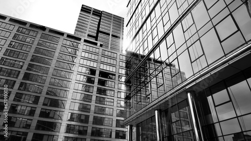 Abstract reflection of modern city glass facades. Modern office building detail, glass surface. Black and white.