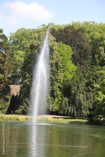 fountain with powerful high water jet in pond