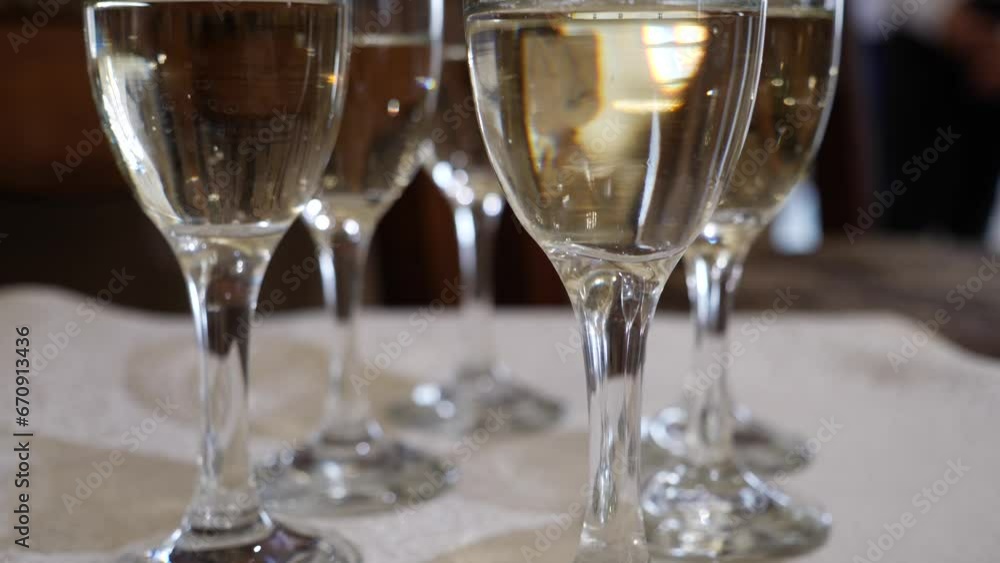 During the celebration, glasses on a thin stem are filled with champagne. During the celebration, glasses on a thin stem are filled with champagne.