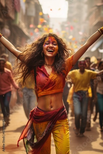 Beautiful Indian woman dancing in the street of India, Holi festival, Phagwah, Bhojpuri, multi-colored powder , festival of colors
