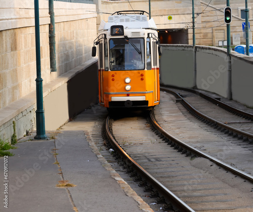 orange tram for transporting commuters and tourists in the capital