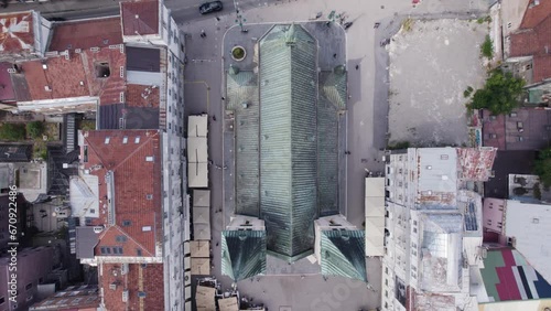 Aerial top view: Sacred Heart Cathedral, surrounded by Sarajevo's urban structures photo