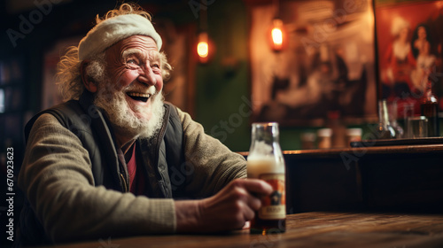 Old man is sitting and laughing in a pub