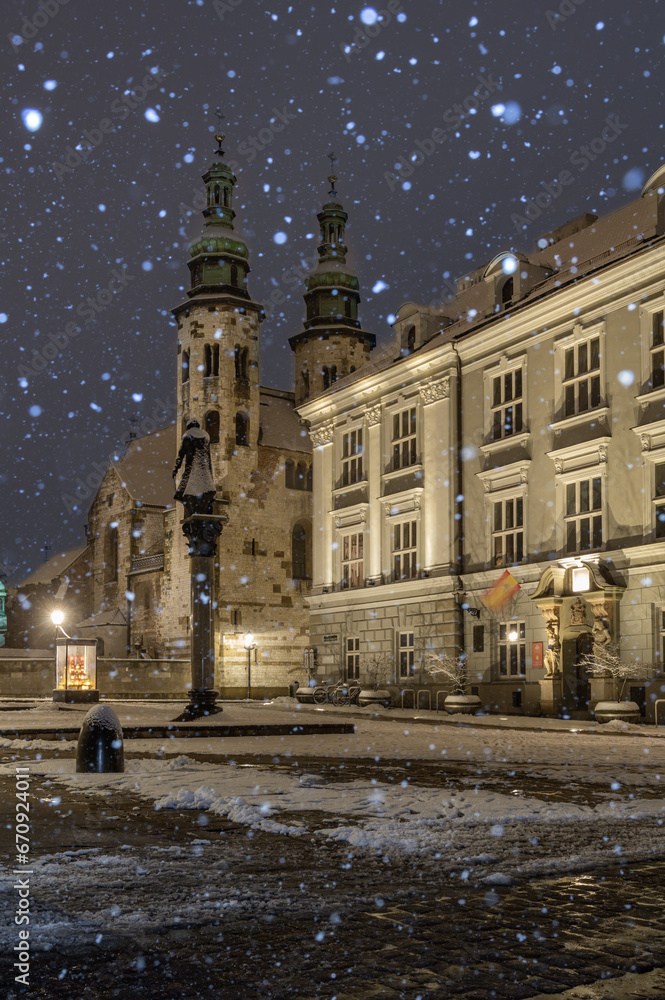 Romanesque St Andrew church on Kanonicza street during snowy night, Krakow, Poland
