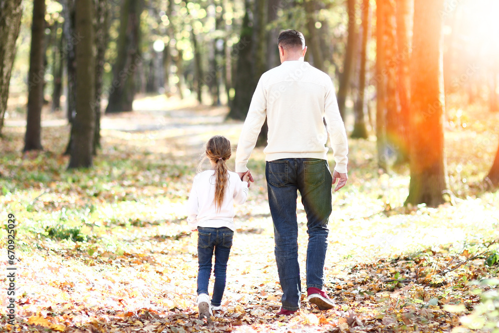 father walks with child in the park father walks with child in the park