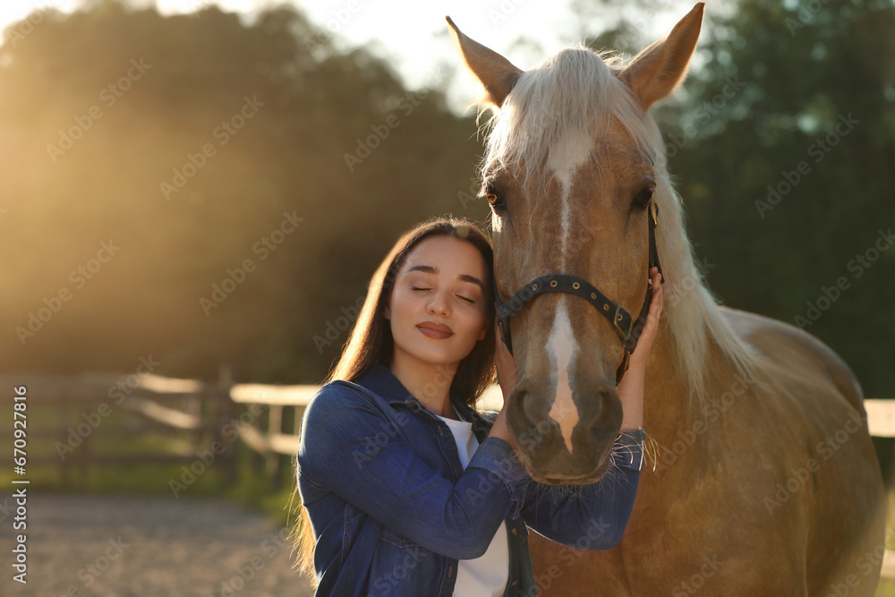 Obraz premium Beautiful woman with adorable horse outdoors. Lovely domesticated pet