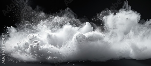 Freezing motion of abstract white powder splattering on a background