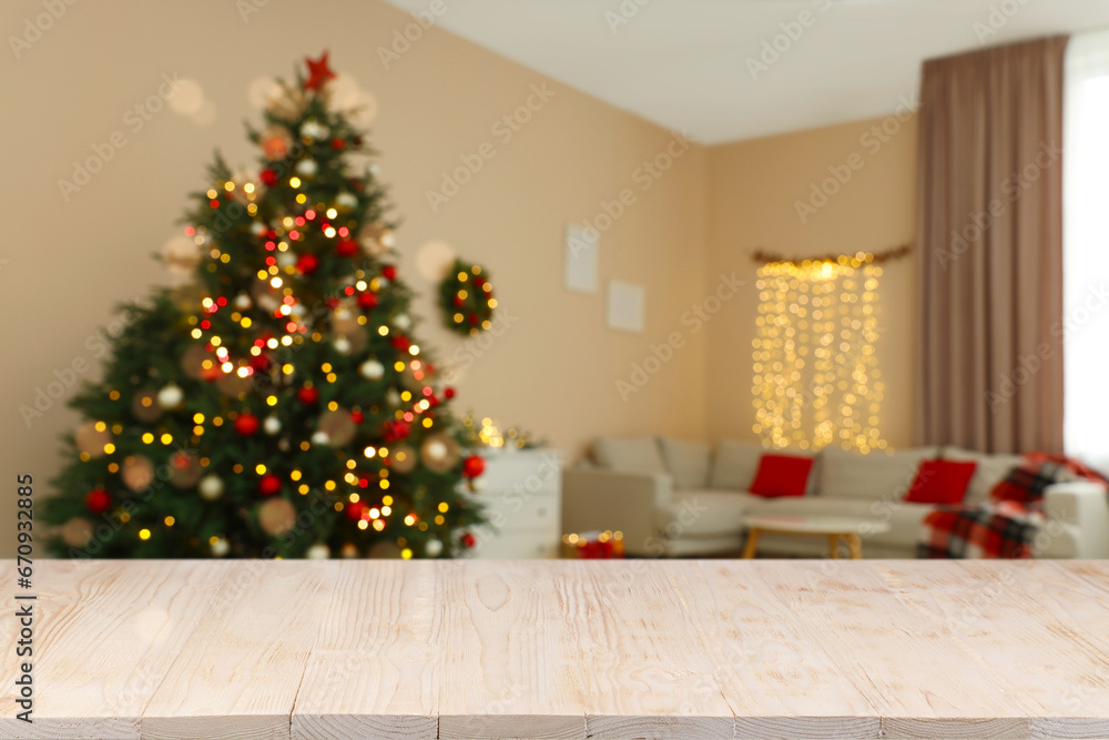 White wooden table in room decorated for Christmas. Space for design