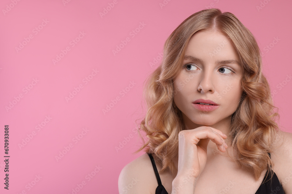 Portrait of beautiful woman with blonde hair on pink background. Space for text Portrait of beautiful woman with blonde hair on pink background. Space for text