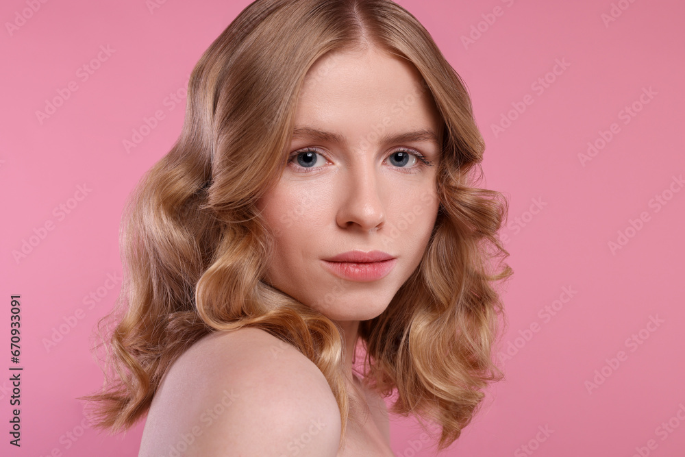 Portrait of beautiful woman with blonde hair on pink background Portrait of beautiful woman with blonde hair on pink background