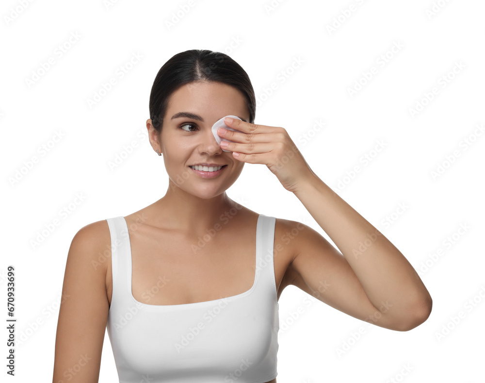 Young woman cleaning her face with cotton pad on white background Young woman cleaning her face with cotton pad on white background