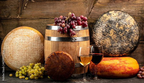 Whole round Head of parmesan or parmigiano hard cheese and wine on a wooden background. farmer market. place for text