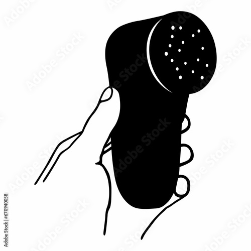 Hand holding a fabric shaver