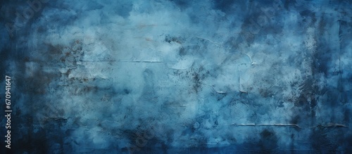 Distressed dark blue background with grunge black edges and light blue backdrop featuring a fancy painted antique texture