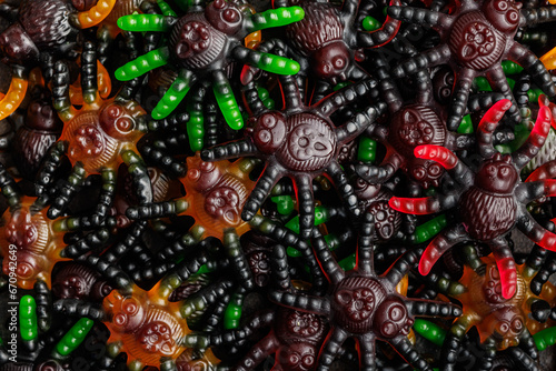 Scary sweet jelly spiders. Halloween candies. Top view.
