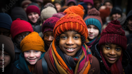 Diverse children in winter hats smiling together