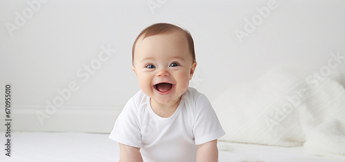 Portrait of a happy baby with Down syndrome. photo