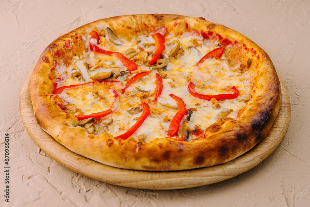 Delicious pizza with chicken, pepper and mushrooms
