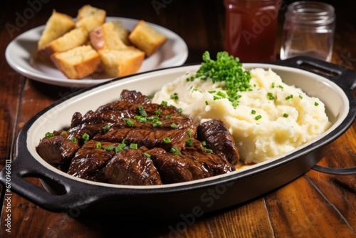 garlic bbq steak tips with a side of mashed potatoes © primopiano