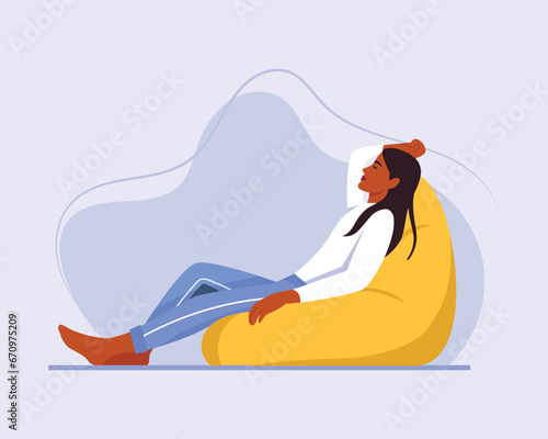 girl sleeps (rests) in a bean bag chair