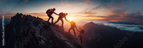 Panoramic view of team of people holding hands and helping each other reach the mountain top in spectacular mountain sunset landscape © IBEX.Media