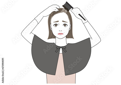 難しい顔をして自分で生え際白髪を染めている女性