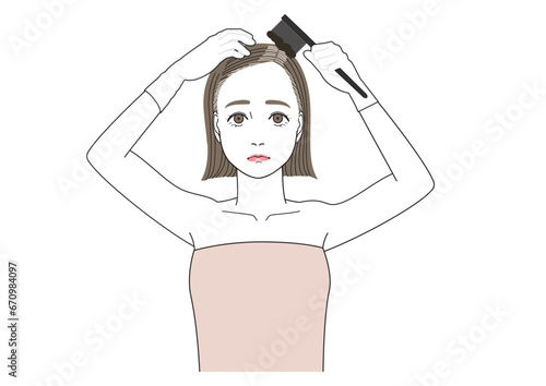 根本白髪を自分で染めている女性