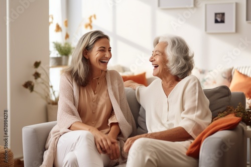 The senior Woman smiles and talks with a friend on sofa in the living room,Comfortable Talks: Elderly Friendship