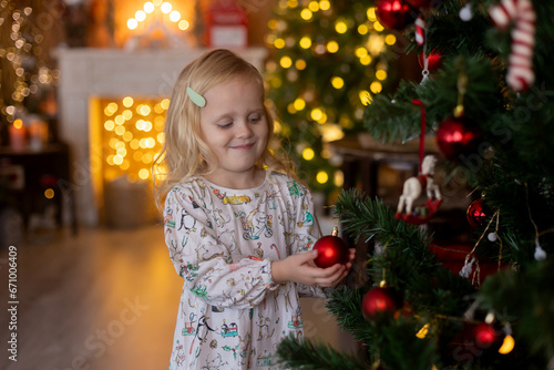 Beautiful children, blond kids, siblings, playing in decorated home for Christmas, enjoying holidays © Tomsickova