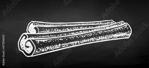 Vector chalk sketch illustration of cinnamon stick. Vintage style drawing on chalkboard background.