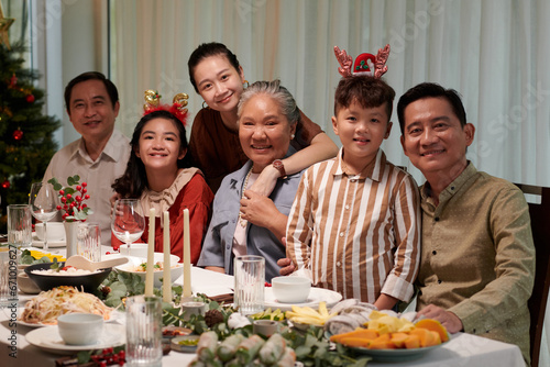 Joyful big Vietnamese family celebrating Christmas together at home
