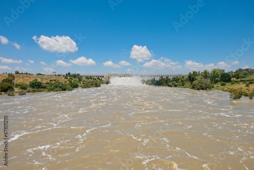 Vaal dam in South Africa with open sluice gates photo