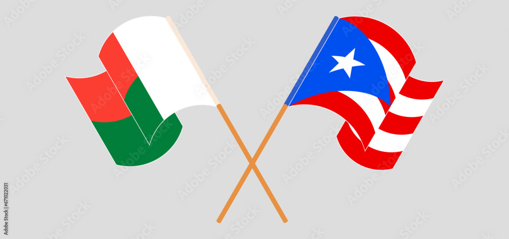Crossed and waving flags of Madagascar and Puerto Rico Crossed and waving flags of Madagascar and Puerto Rico